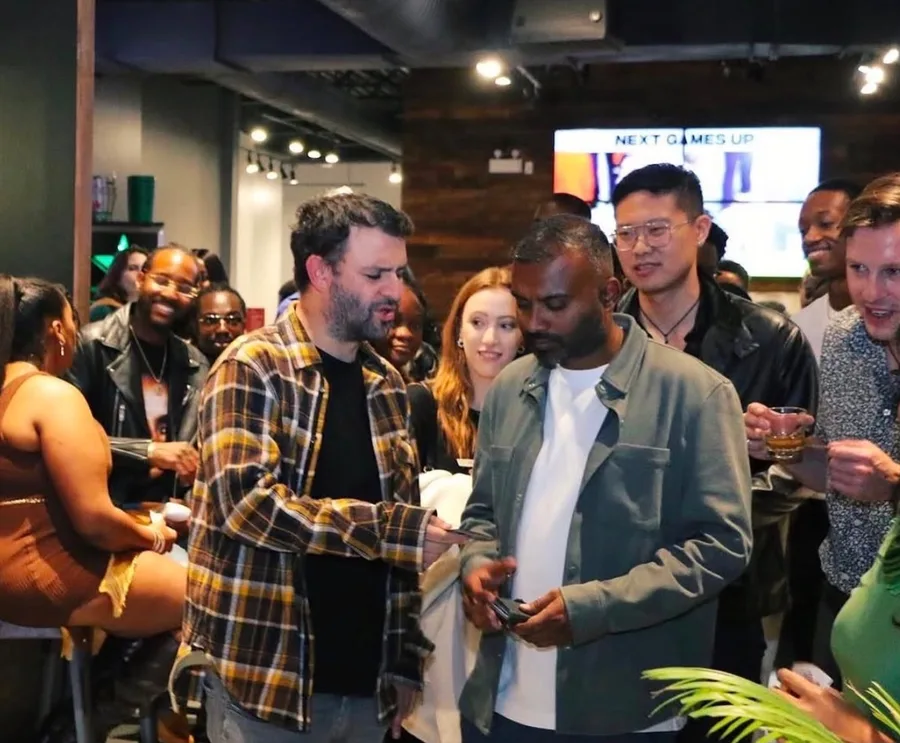 A crowd of guests networking