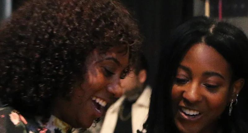 Guests laughing together at an Ascend Collective event